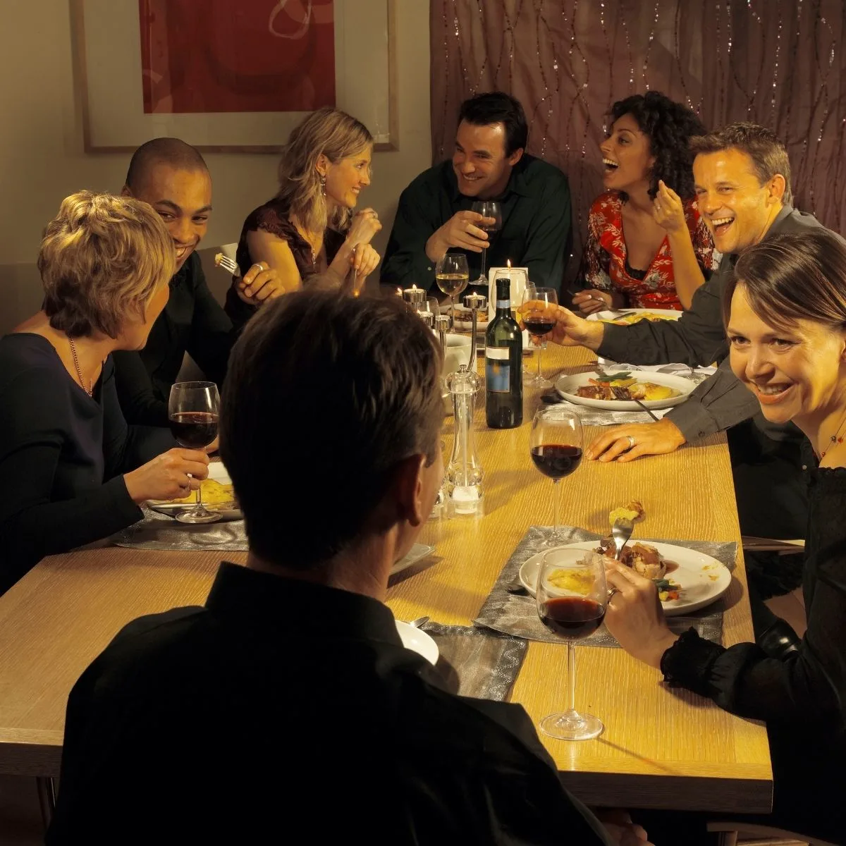 group of people enjoying birthday dinner at a restaurant 