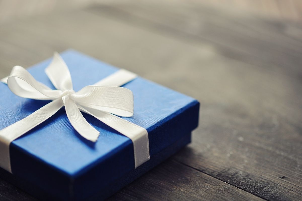 blue gift box with a white bow