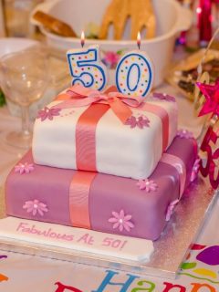 50th birthday decorations, and cake that says 