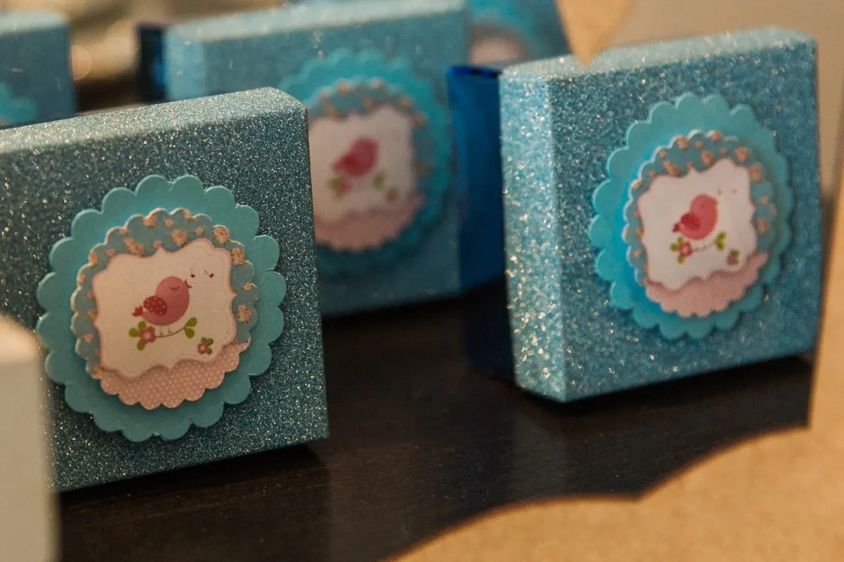 blue party favor boxes stamped with cute bird