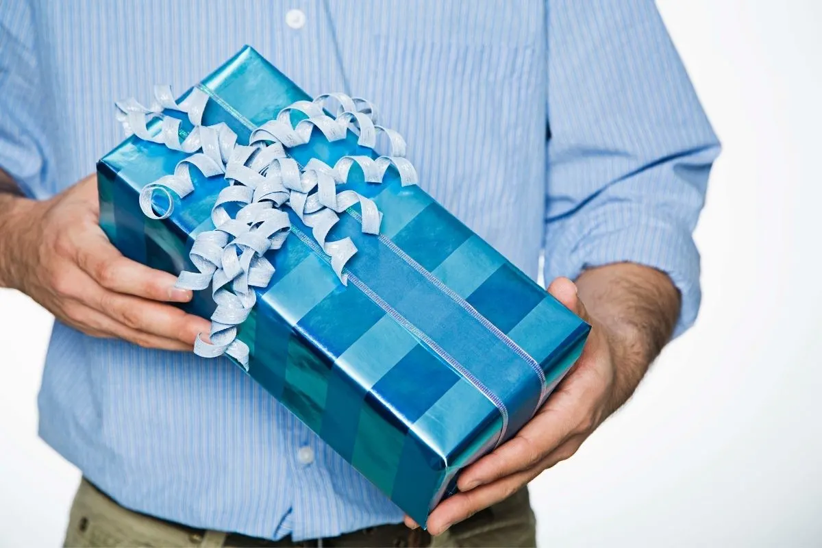 man holding a gift box