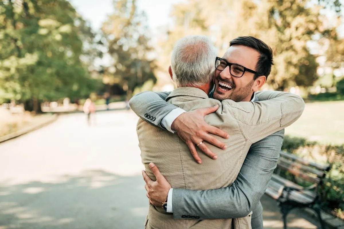 two men hugging as they reunite