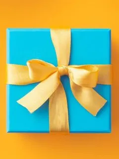blue gift box with a gold bow