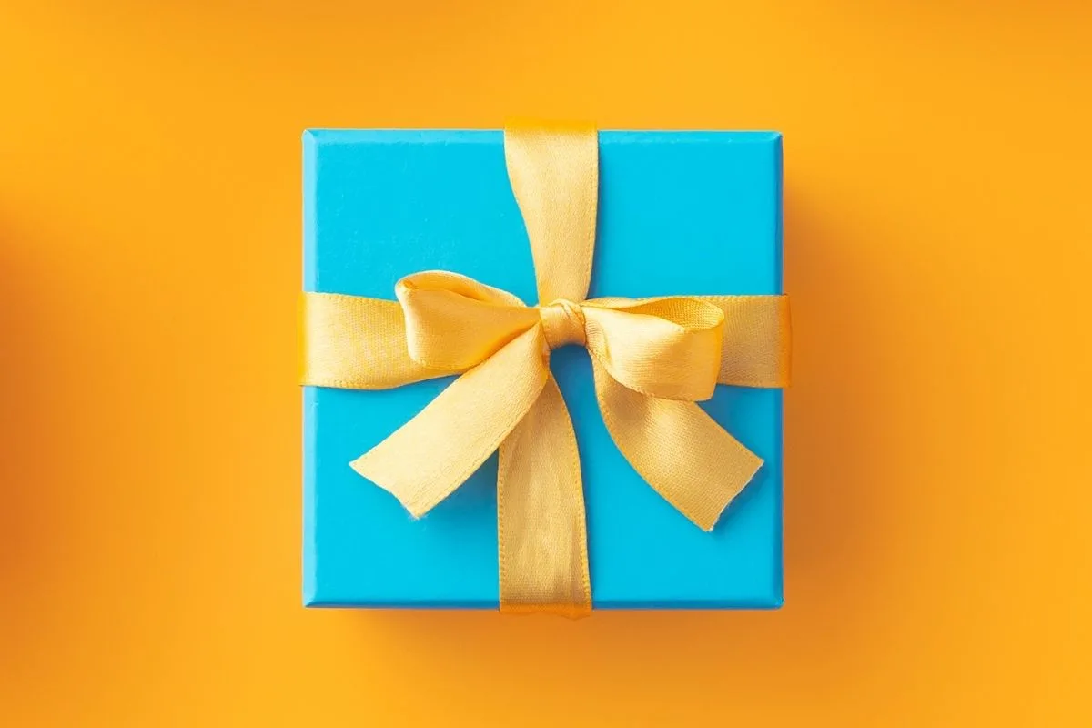 blue gift box with a gold bow