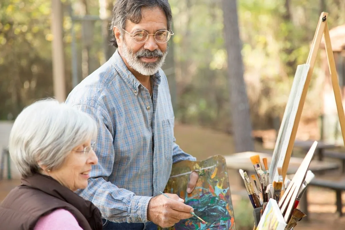 couple painting out in nature