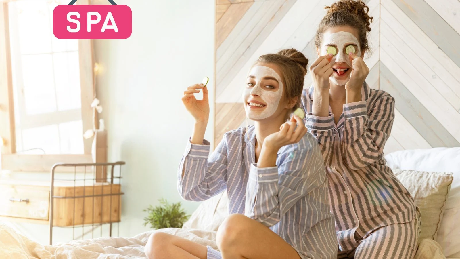 Two young women with face masks on enjoying themselves.